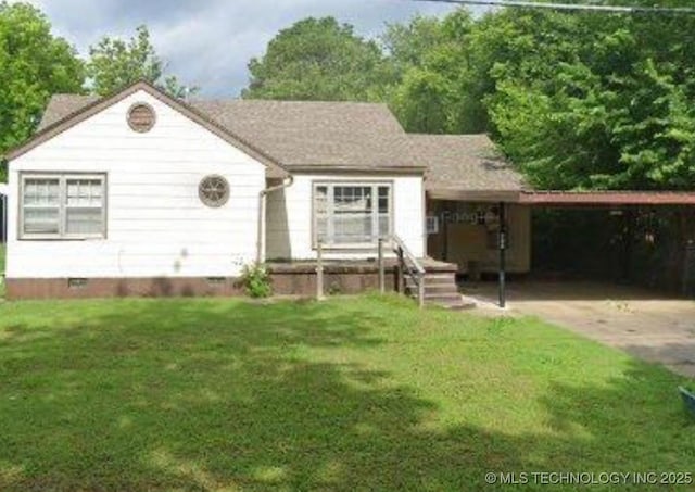 615 11th St, Pawnee, OK 74058 - view of front of property with crawl space, a carport, and a front lawn