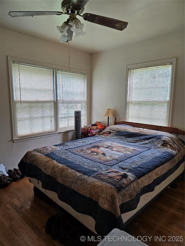 615 11th St, Pawnee, OK 74058 - bedroom with wood finished floors and a ceiling fan