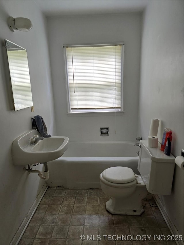 615 11th St, Pawnee, OK 74058 - bathroom featuring a tub to relax in