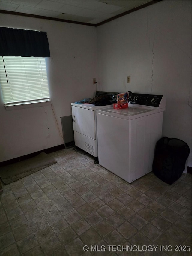 615 11th St, Pawnee, OK 74058 - laundry room featuring separate washer and dryer and baseboards