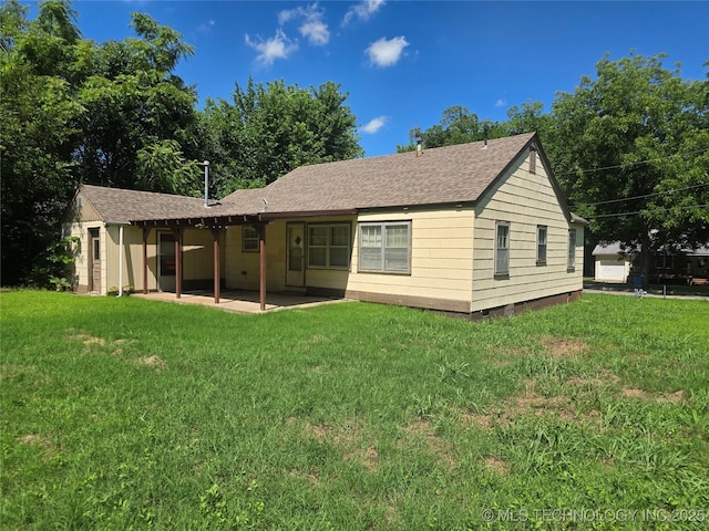 615 11th St, Pawnee, OK 74058 - rear view of property with a patio area, crawl space, a lawn, and a shingled roof