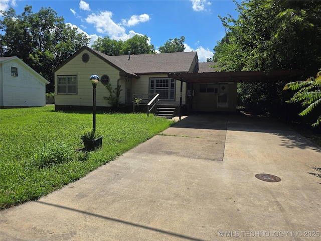 615 11th St, Pawnee, OK 74058 - ranch-style house featuring driveway, a front yard, and an attached carport
