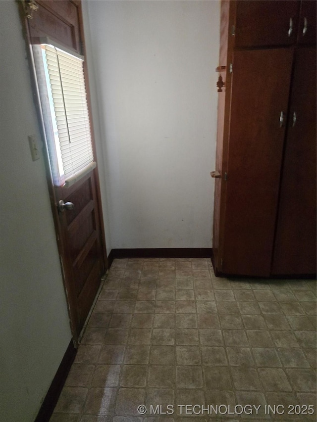 615 11th St, Pawnee, OK 74058 - doorway to outside featuring baseboards