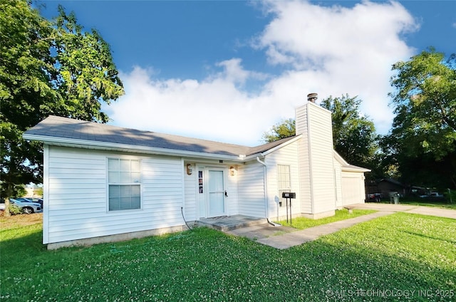 301 S Division St, Sapulpa, OK 74066 - view of front of home with a chimney, a front yard, concrete driveway, and an attached garage