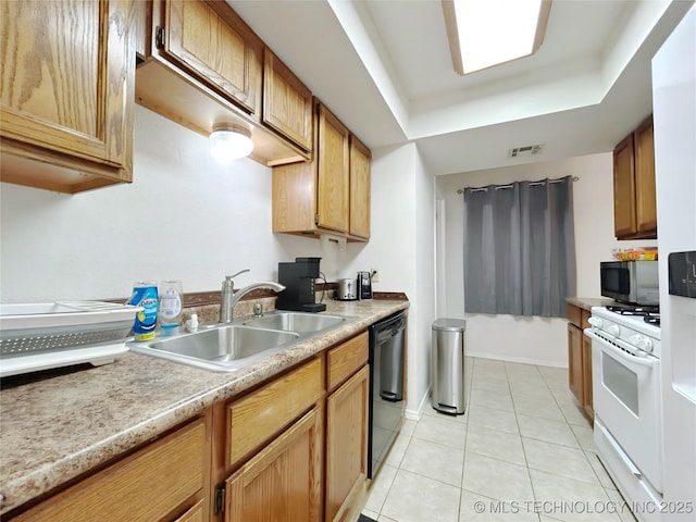 301 S Division St, Sapulpa, OK 74066 - kitchen with white gas range oven, dishwasher, a raised ceiling, stainless steel microwave, and light tile patterned flooring