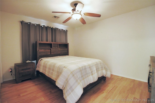 301 S Division St, Sapulpa, OK 74066 - bedroom featuring wood finished floors and a ceiling fan