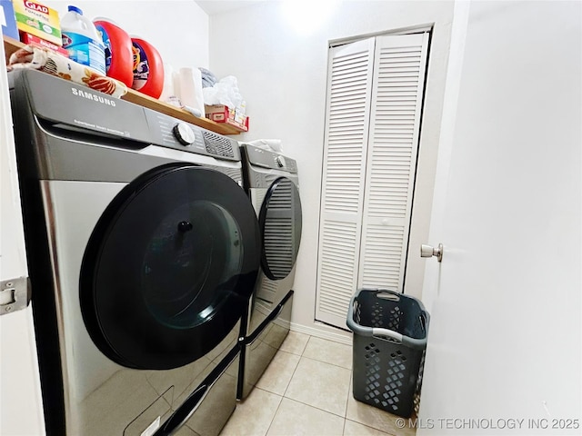 301 S Division St, Sapulpa, OK 74066 - laundry room with washer and dryer and light tile patterned floors