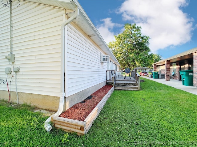 301 S Division St, Sapulpa, OK 74066 - view of grassy yard featuring a wall unit AC