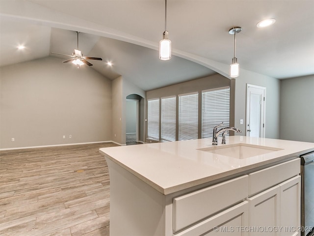 3604 E Quebec St, Broken Arrow, OK 74014 - kitchen with arched walkways, open floor plan, a ceiling fan, light wood-type flooring, and recessed lighting