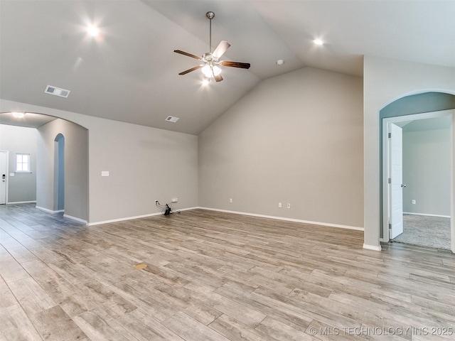 3604 E Quebec St, Broken Arrow, OK 74014 - unfurnished living room with arched walkways, ceiling fan, vaulted ceiling, and light wood finished floors
