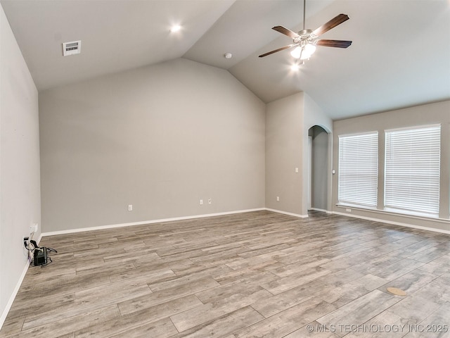 3604 E Quebec St, Broken Arrow, OK 74014 - unfurnished room featuring a ceiling fan, light wood finished floors, vaulted ceiling, and arched walkways