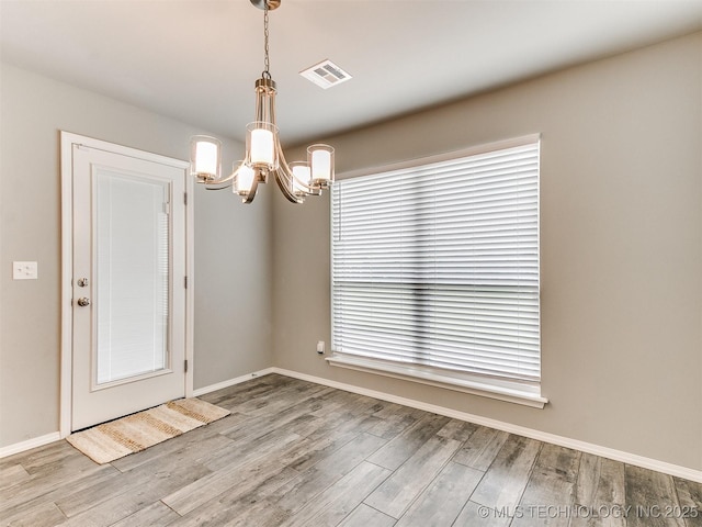 3604 E Quebec St, Broken Arrow, OK 74014 - empty room with a chandelier and wood finished floors