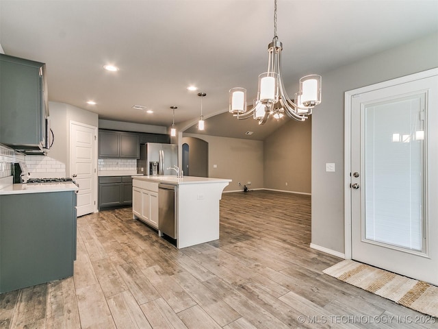 3604 E Quebec St, Broken Arrow, OK 74014 - kitchen featuring appliances with stainless steel finishes, light countertops, tasteful backsplash, light wood finished floors, and recessed lighting