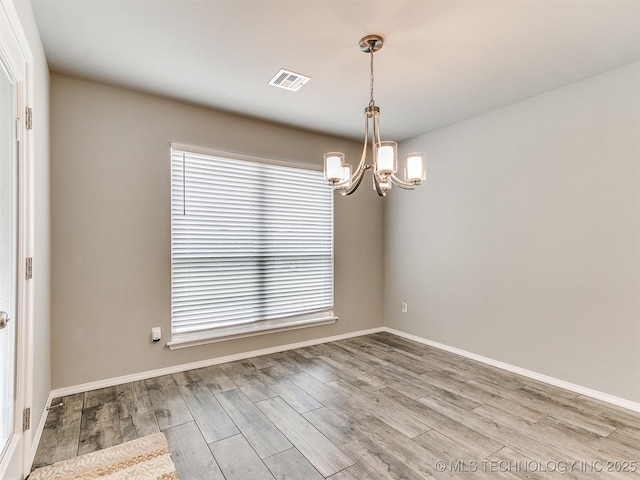 3604 E Quebec St, Broken Arrow, OK 74014 - spare room featuring a chandelier, healthy amount of natural light, and wood finished floors