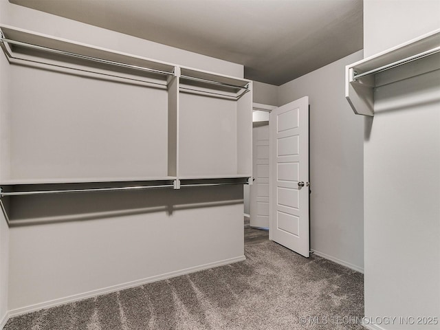 3604 E Quebec St, Broken Arrow, OK 74014 - walk in closet featuring dark colored carpet
