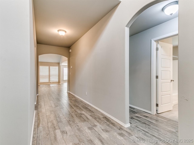 3604 E Quebec St, Broken Arrow, OK 74014 - hallway featuring arched walkways and light wood-style floors