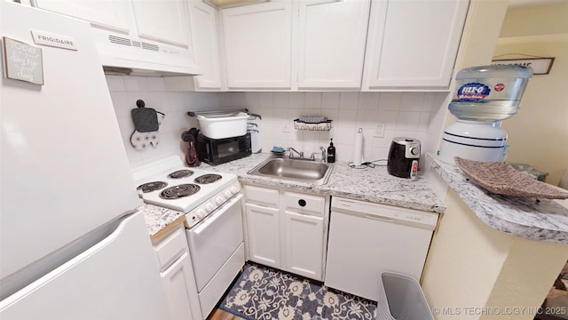 6663 S Victor Ave Unit Hj303, Tulsa, OK 74136 - kitchen with white appliances, under cabinet range hood, light countertops, tasteful backsplash, and white cabinets