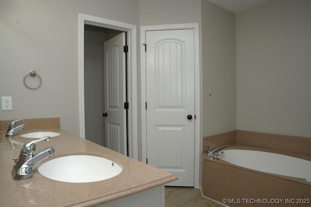 11906 S Nandina St, Jenks, OK 74037 - full bath with a bath, double vanity, and wood finished floors