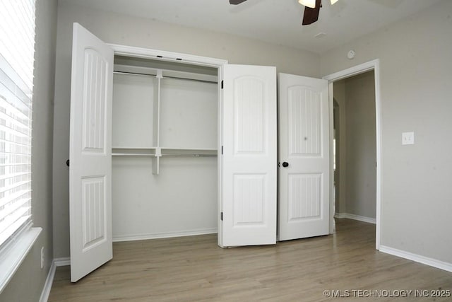 11906 S Nandina St, Jenks, OK 74037 - unfurnished bedroom featuring wood finished floors, a closet, and ceiling fan
