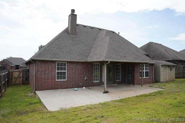11906 S Nandina St, Jenks, OK 74037 - back of property with brick siding, a fenced backyard, a chimney, a storage shed, and a patio