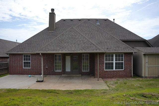 11906 S Nandina St, Jenks, OK 74037 - back of property featuring brick siding, roof with shingles, and a patio area