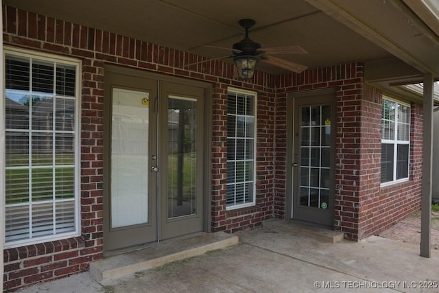 11906 S Nandina St, Jenks, OK 74037 - view of exterior entry with brick siding and a ceiling fan