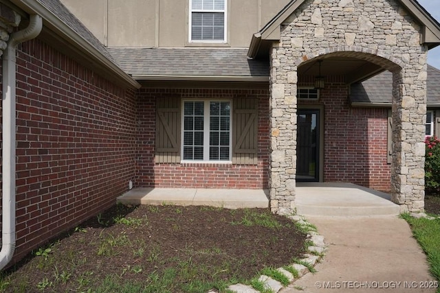 11906 S Nandina St, Jenks, OK 74037 - property entrance with brick siding and stone siding