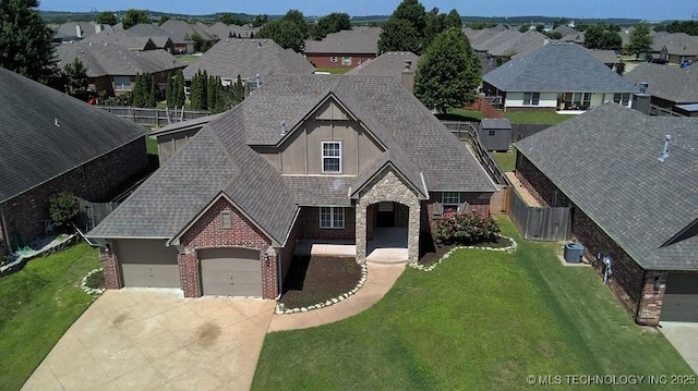 11906 S Nandina St, Jenks, OK 74037 - view of front of house featuring driveway, a residential view, brick siding, and a shingled roof