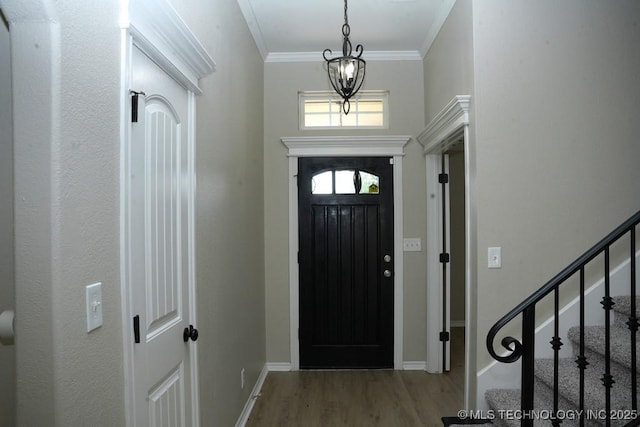 11906 S Nandina St, Jenks, OK 74037 - foyer entrance with wood finished floors, ornamental molding, stairway, and a chandelier