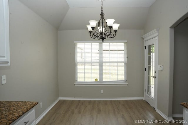 11906 S Nandina St, Jenks, OK 74037 - unfurnished dining area with a chandelier, wood finished floors, healthy amount of natural light, and vaulted ceiling