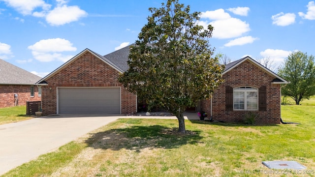 1704 Estates Dr, Grove, OK 74344 - view of front of property featuring brick siding, driveway, a front lawn, and a garage
