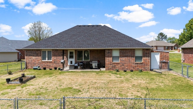 1704 Estates Dr, Grove, OK 74344 - back of property with a fenced backyard, a gate, a patio, a shingled roof, and brick siding
