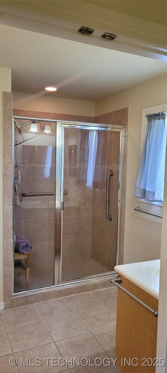 1704 Estates Dr, Grove, OK 74344 - bathroom with vanity, a shower stall, and tile patterned flooring