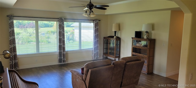 1704 Estates Dr, Grove, OK 74344 - living area with wood finished floors, ceiling fan, arched walkways, and plenty of natural light