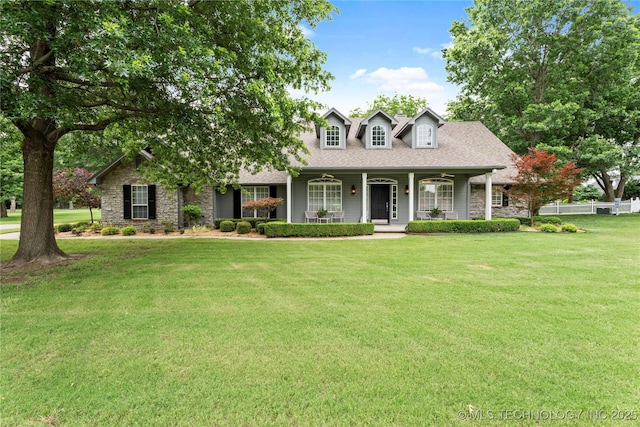 5070 Lake Breeze Rd, Grove, OK 74344 - cape cod house with stone siding, a porch, and a shingled roof