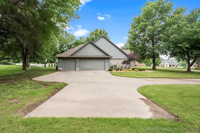 5070 Lake Breeze Rd, Grove, OK 74344 - view of front of house featuring a front lawn, driveway, an attached garage, and roof with shingles