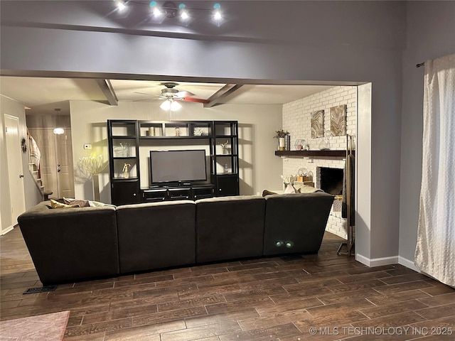 5908 S 68th E Ave, Tulsa, OK 74145 - living room with wood finish floors, beamed ceiling, a ceiling fan, and a brick fireplace