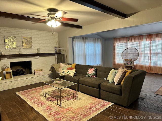 5908 S 68th E Ave, Tulsa, OK 74145 - living area with beamed ceiling, a ceiling fan, dark wood-style flooring, and a fireplace