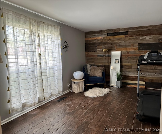 5908 S 68th E Ave, Tulsa, OK 74145 - living area featuring wood walls, wood finished floors, and an accent wall