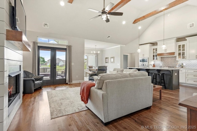 14305 S College Ave, Bixby, OK 74008 - living room featuring high vaulted ceiling, ceiling fan, beamed ceiling, dark wood-style floors, and french doors