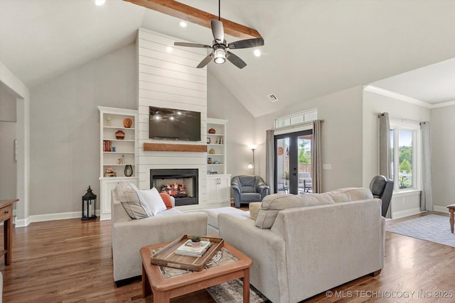 14305 S College Ave, Bixby, OK 74008 - living room with high vaulted ceiling, wood finished floors, ceiling fan, a large fireplace, and recessed lighting