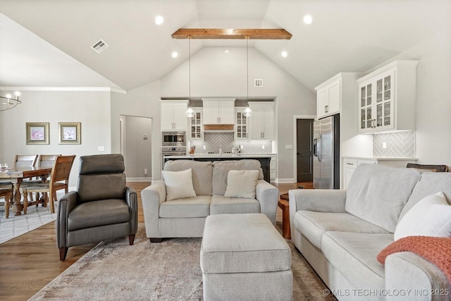 14305 S College Ave, Bixby, OK 74008 - living area featuring wood finished floors, high vaulted ceiling, a chandelier, recessed lighting, and beamed ceiling