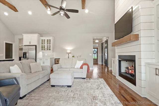 14305 S College Ave, Bixby, OK 74008 - living room with ceiling fan, wood finished floors, a large fireplace, and recessed lighting