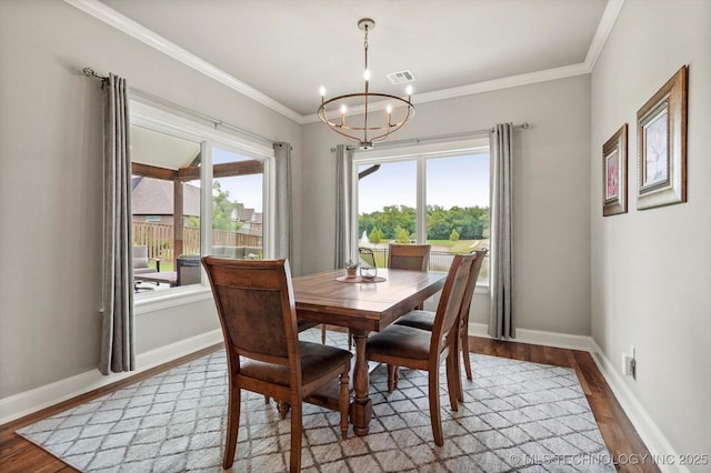14305 S College Ave, Bixby, OK 74008 - dining area featuring light wood-style flooring, a chandelier, and ornamental molding
