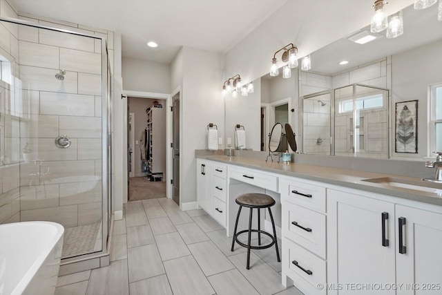 14305 S College Ave, Bixby, OK 74008 - bathroom with a stall shower, a freestanding tub, vanity, and recessed lighting