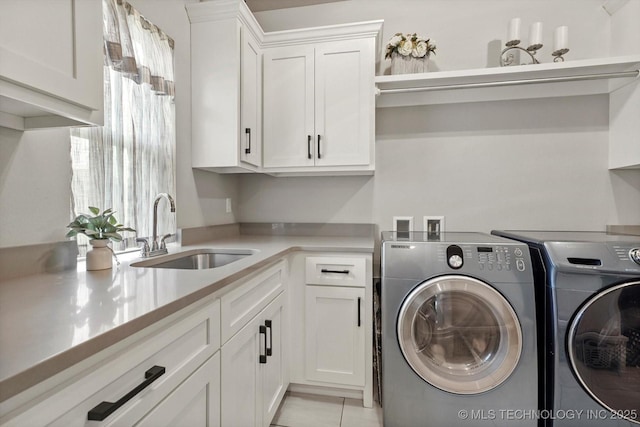 14305 S College Ave, Bixby, OK 74008 - laundry area featuring washer and clothes dryer and cabinet space