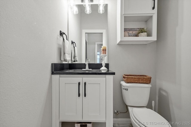 14305 S College Ave, Bixby, OK 74008 - half bathroom featuring toilet and vanity