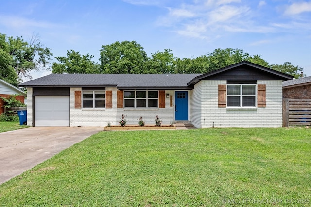 12317 E 18th St, Tulsa, OK 74128 - ranch-style house featuring brick siding, an attached garage, and concrete driveway