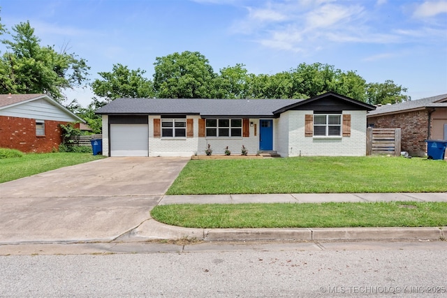 12317 E 18th St, Tulsa, OK 74128 - single story home featuring an attached garage, driveway, and brick siding