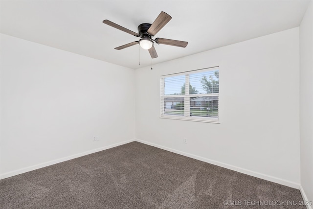 12317 E 18th St, Tulsa, OK 74128 - empty room featuring dark carpet and a ceiling fan
